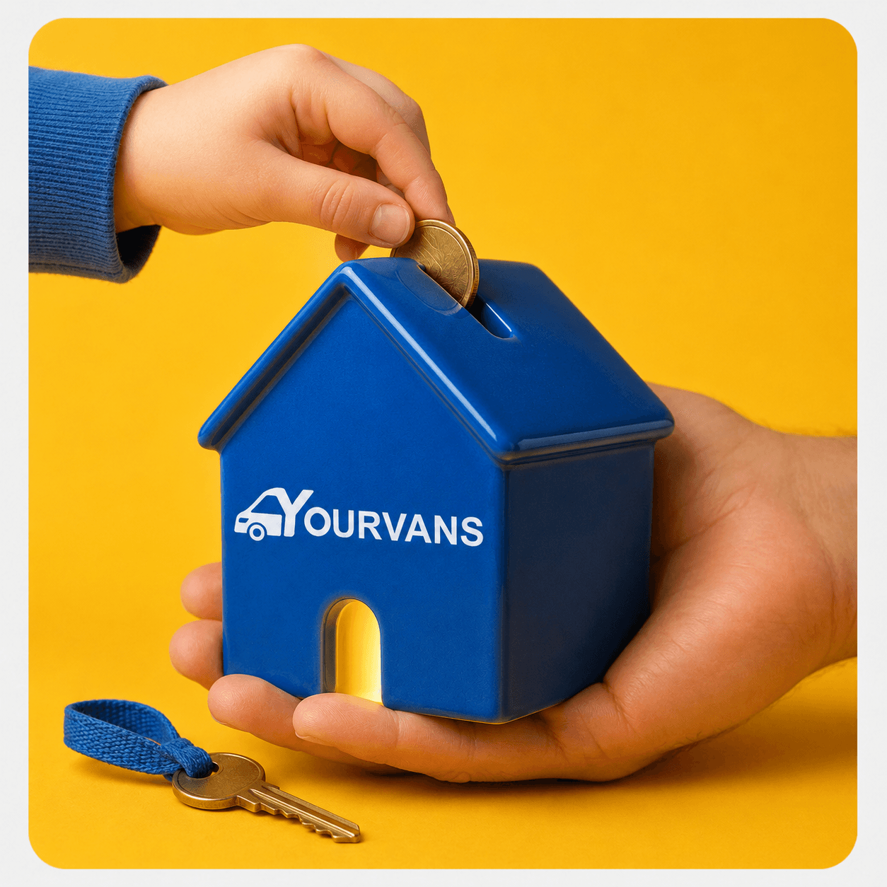 A child dropping a coin into a YourVans house, held in an adult’s hand