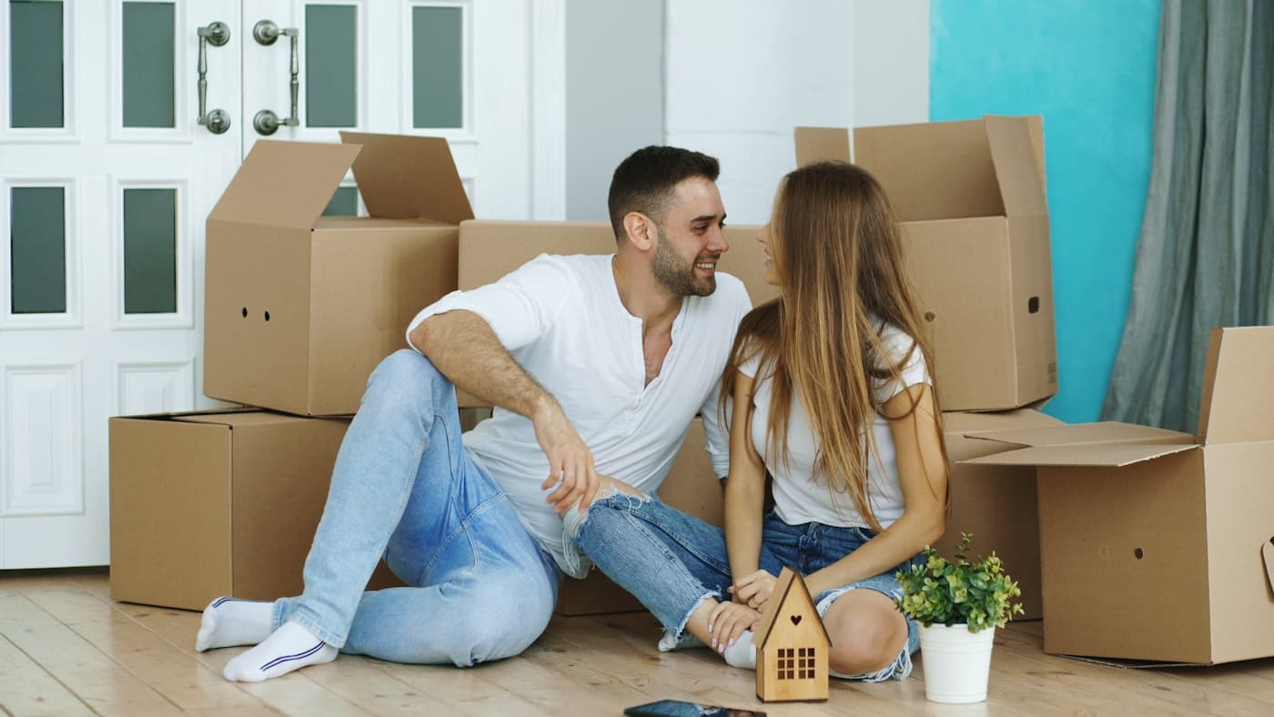 A happy North East couple settling into their new home after a YourVans move