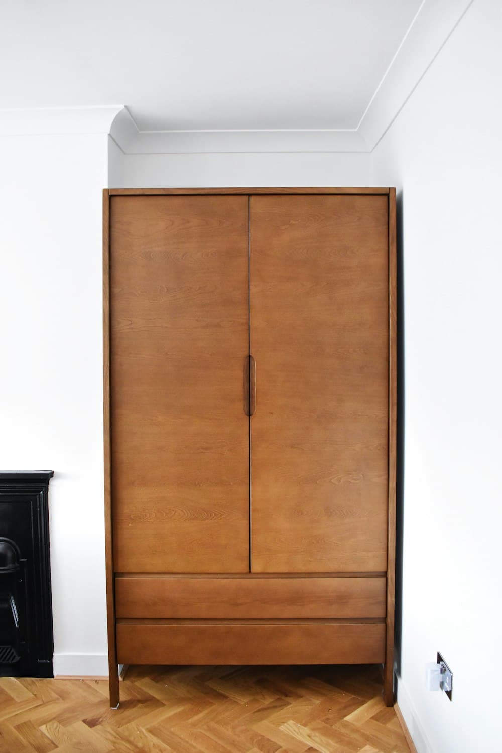 Furniture in a living room being assessed ahead of a house move